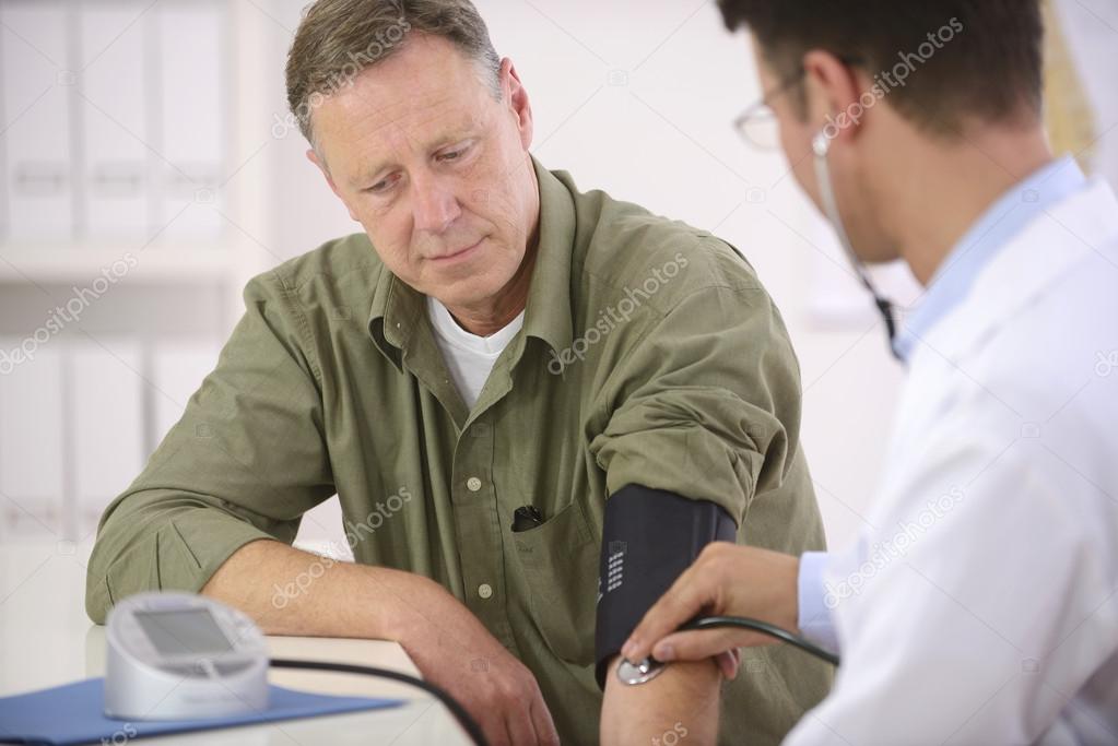 Depositphotos 12298262 Stock Photo Doctor Checking Blood Pressure
